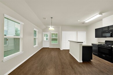 This is a bright, modern kitchen with dark cabinet