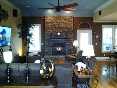 THIS ENORMOUS GREAT ROOM BOASTS 12 FT CEILINGS, STACKED STONE FIREPLACE, SURROUND SOUND AND HARDWOOD FLOORING!