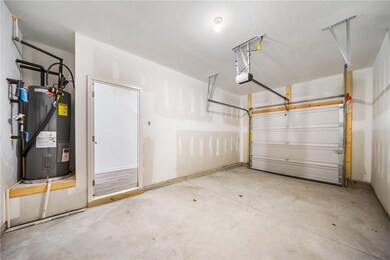 One car garage featuring a garage door opener