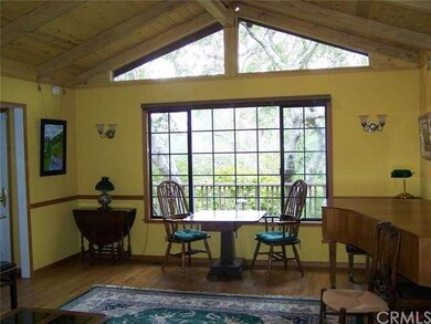 Family room.  Note consistent vaulted/beamed ceili