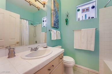 Full bathroom with vanity and tile patterned floors