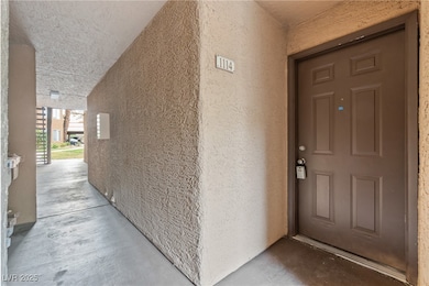 View of exterior entry with stucco siding
