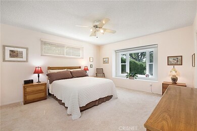 Master bedroom suite enhanced by bay wndow