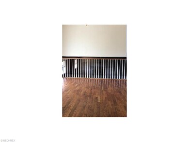 hardwood flooring in dining room with spindle open