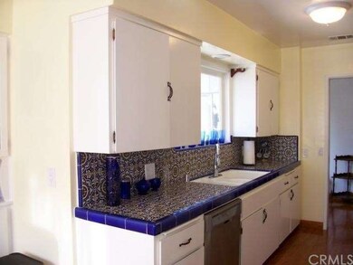 Beautiful Kitchen tile and newer stainless dishwas