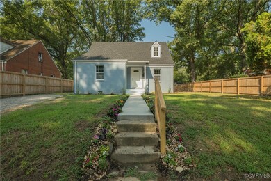 New england style home featuring a front yard
