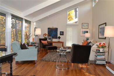 The living room features a vaulted ceiling, recess