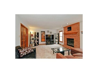 Family Room. OVERSIZED RAISED HEARTH BRICK FIREPLA