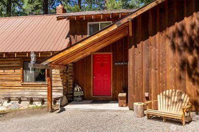 The gravel entry court and covered porch makes for easy access year-round.