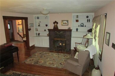 Living room with gas remote fireplace. Builtin cup