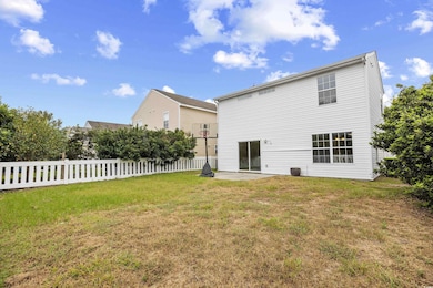 Rear view of property with a patio