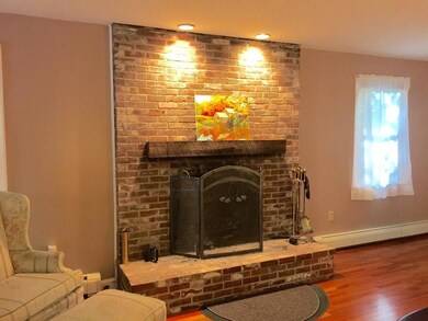 wood burning fireplace with brick hearth