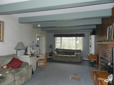 spacious living room has a fireplace