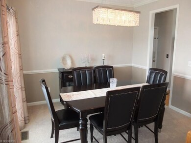 Formal dining room with chair rail, crown molding 