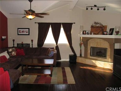 Living room with travertine fireplace