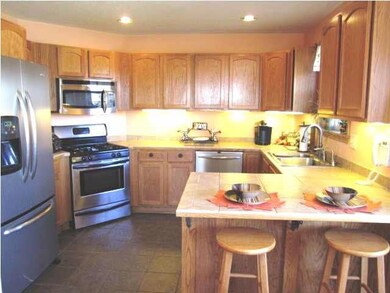 Kitchen offers wonderful layout, eating bar and st