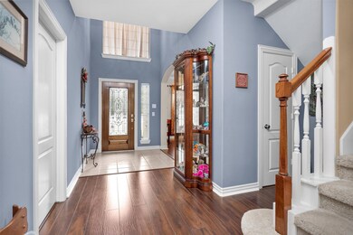 The entry features a beautiful stained glass door