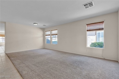 Unfurnished room featuring light colored carpet, b
