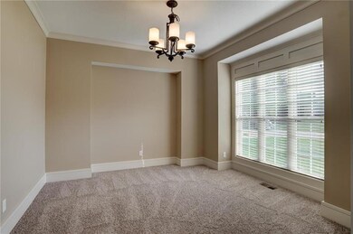 Formal dining room - features new carpet and updat