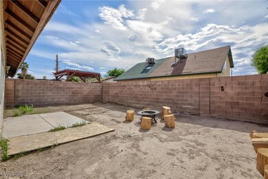 View of yard with a fenced backyard, central AC un