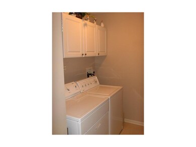 Laundry room also serves as a mud room between gar
