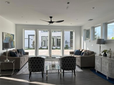 Living area featuring dark wood-style flooring, a