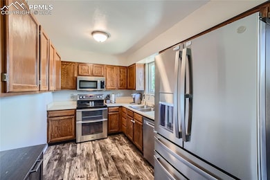 Kitchen featuring appliances with stainless steel 