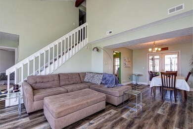 Living room connects with dining room and stairs h