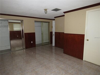 Master bedroom has double closets, mirrored door, crown molding, and bath.