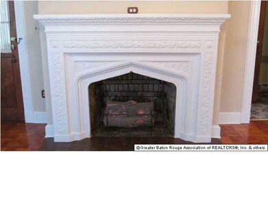 Two massive fireplaces with intricate details and 
