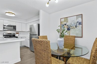 Dining room with light wood-style floors and a tex