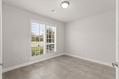 A private study through double glass doors adds a touch of sophistication and privacy to the home.