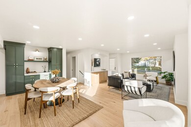 Dining space featuring light wood flooring, recessed lighting, and built-ins