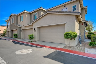 Multi unit property featuring a garage and stucco