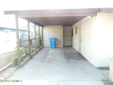 Covered Carport with Storage Room