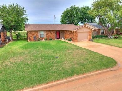 Single story home featuring brick siding, an attac