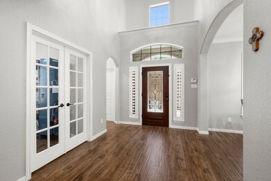 Downstairs, in addition to the primary bedroom is the guest suite with full bath and a study with french doors