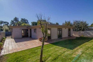 Spacious backyard and an tiled patio