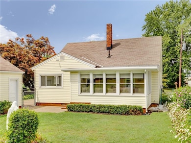Back of home, Sunroom and fenced in yard