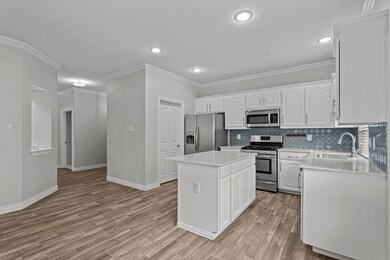 Kitchen with appliances with stainless steel finis