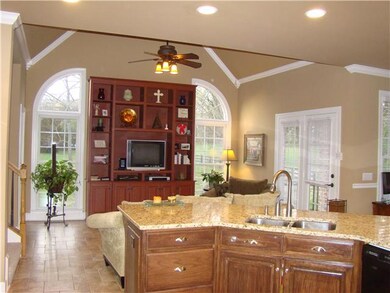 Beautiful Kitchen Island with Granite Countertops and Sitting Rm off Kitchen