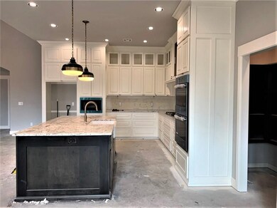 WOW, this is what I call a spacious kitchen.  Meas