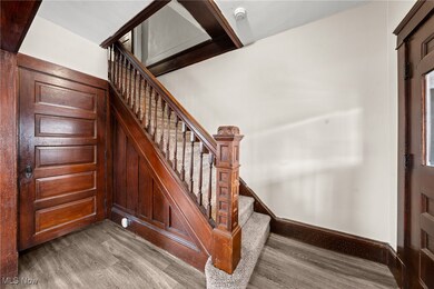 Stairway featuring wood-type flooring