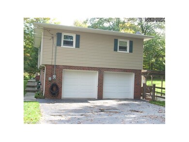2 car garage attached and one car garage in the ov