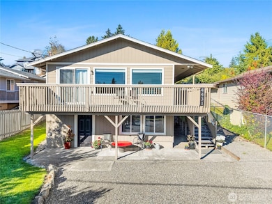 South facing home with wrap around deck and ample parking.