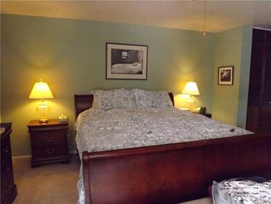 Large master bedroom with glass slider to backyard