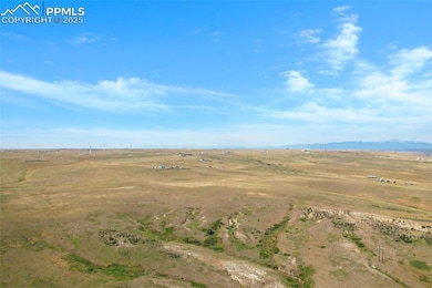 Aerial overview of property's location featuring rural landscape and a mountain backdrop