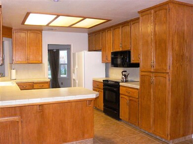 Kitchen with tile floor, 2'X2' tile counter, Kohle