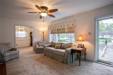 Living Room w/ New Carpet over hardwood.