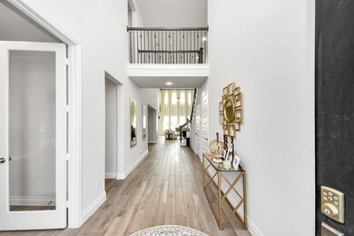 The high ceilings, light colored wood-like tile, a